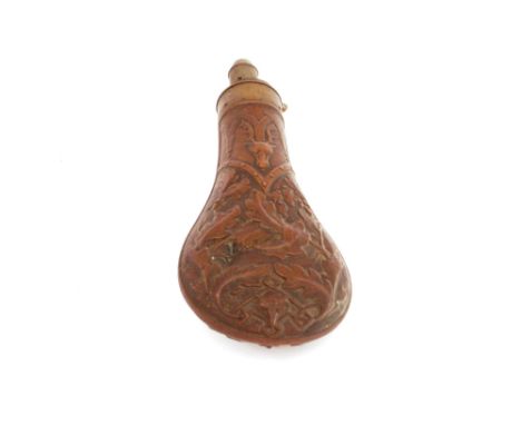 A 19th Century copper shot flask with raised decoration