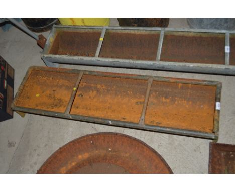 An old galvanised three section pig trough 