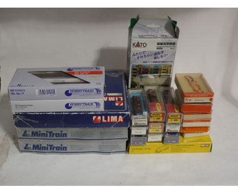 A collection of "N" gauge train and models, to include: a Hobby train locomotive and tender box sets, H22020 and H11201; thre