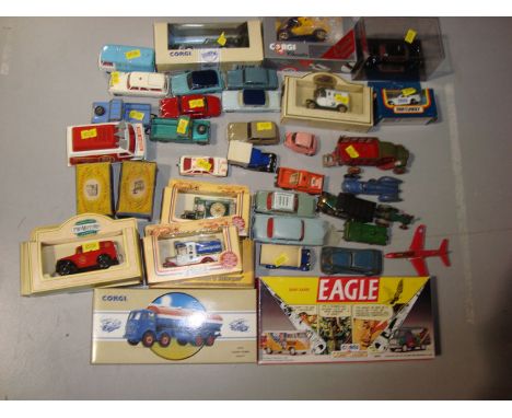 A quantity of Corgi vehicles, including a boxed Foden Tanker Regent; a Dan-Air Eagle box set; two Land Rovers; a Hillman Husk