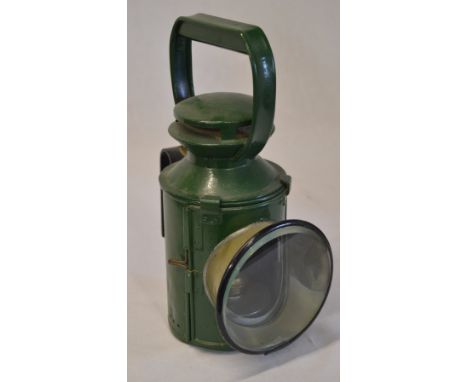 Green painted railway hand lamp with interior burner marked 'BR LMR'
