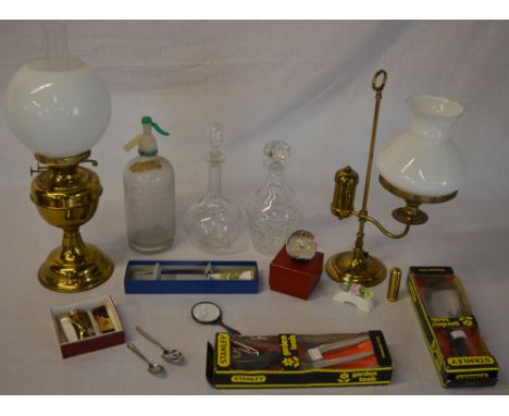 Mixed lot including decanters, soda syphon, garden tools, paperweight, lamps etc