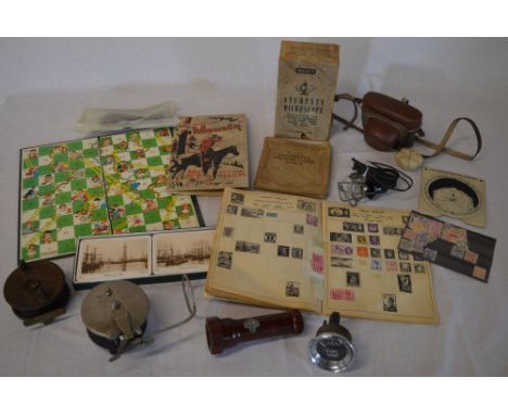 2 fishing reels, cigarette cards, snakes & ladders board, microscope, vintage fuel gauge, camera, stamps etc