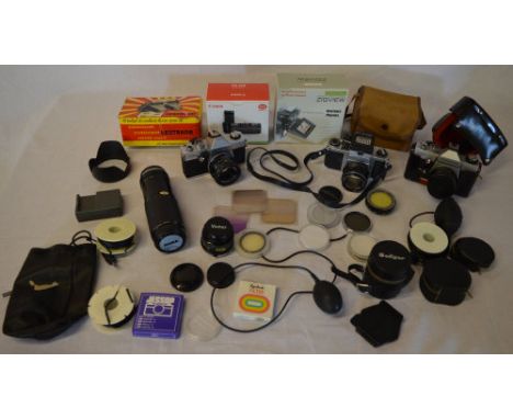Various vintage cameras and accessories including Asahi Pentax, Praktica PLC3, various filters, lenses, cases, stereoscope et