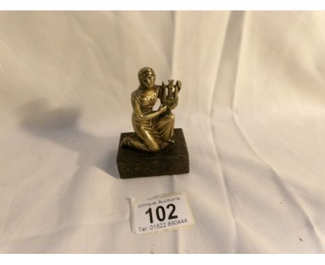 A 19th century classical brass lady with harp