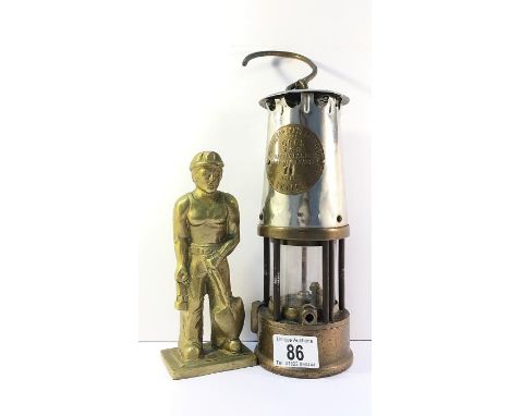 A 'Davy' lamp and a heavy brass miner figure