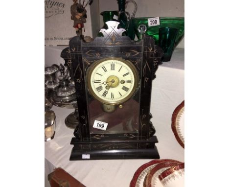 A black mantel clock