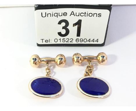 A pair of 9ct gold and enamel cuff links