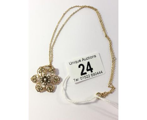 An Edwardian 9ct gold seed pearl pendant