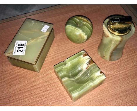 An onyx cigarette box, onyx lighter and 2 other onyx items