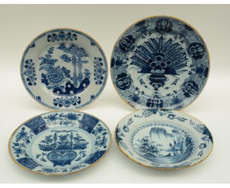 A late 17thC blue and white decorated Dutch Delftware plate; added three ditto plates marked 'De Byl' and 'De Clauw', Diamete
