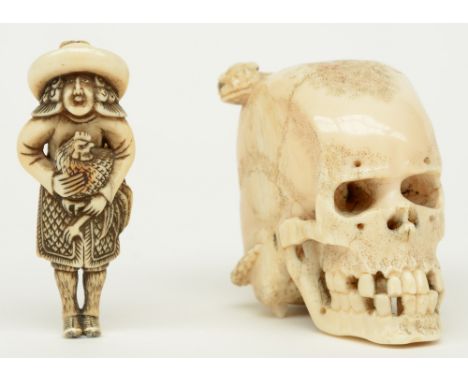An exceptional Japanese ivory okimono of a skull with a snake, Edo period, 18thC (a piece of the snake missing on the backsid