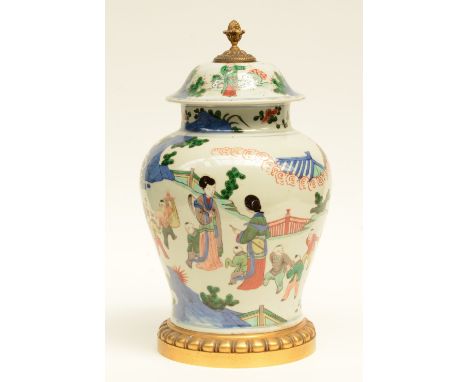 A Chinese wucai vase with cover, decorated with children playing in a garden, gilt brass mounts, 19thC, H 46,5 cm (bottom and