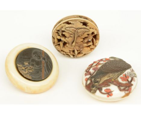 Three late Edo and early Meiji period Japanese ivory Manju-netsuke, one of them of the Ry?sa type and another of the Kagamibu