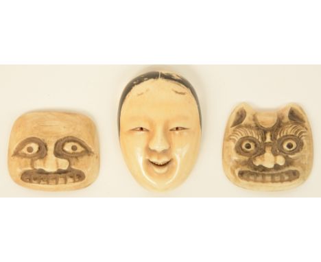 Three early Meiji period Japanese ivory netsuke in the form of masks, one of them a Noh theater mask, H 5,1cm, Total weight 4