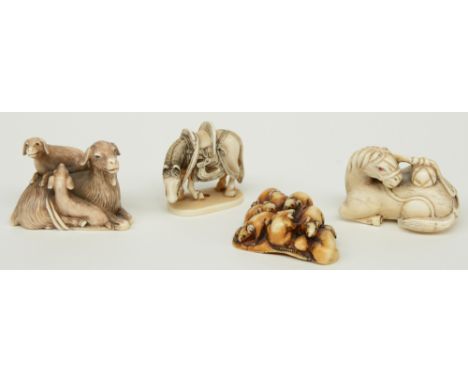 Four late Edo period Japanese ivory katabori-netsuke, two in the form of horses, one in the form of goats and one in the form