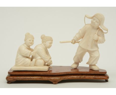 A Chinese ivory group depicting a winter scene with playing children, first half 20thC, H 7,5 - 12,4 cm (without base), Weigh