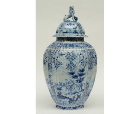 An imposing blue and white decorated Dutch Delftware vase and cover, late 19thC, marked, H 68,5 cm