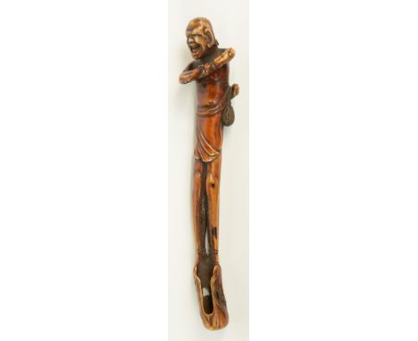 A tinted ivory Japanese sashi netsuke - kiseruzutsut depicting a jolly monk, Meiji-period, signed, H 21,7 cm, weight 93g.