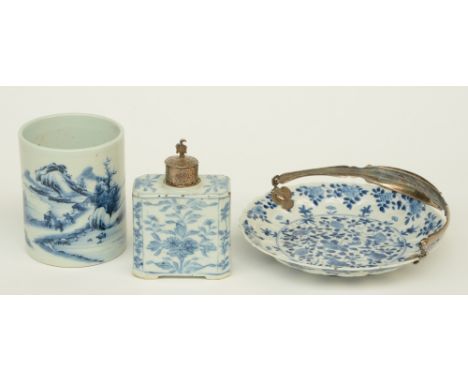 A Chinese blue and white plate and tea caddy, floral decorated, with 19thC silver mounts, plate lotus-moulded and marked Kang