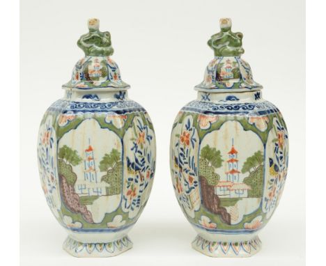 A pair of polychrome decorated Dutch Delftware jars and covers, maked with a H.B. monogram ('De Porceleyne Byl), 18thC, H 25c