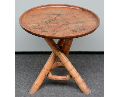 A last quarter of the 19thC occasional table with a bamboo woven tripod an a painted mahogany top, H 74 - Diameter 75 cm