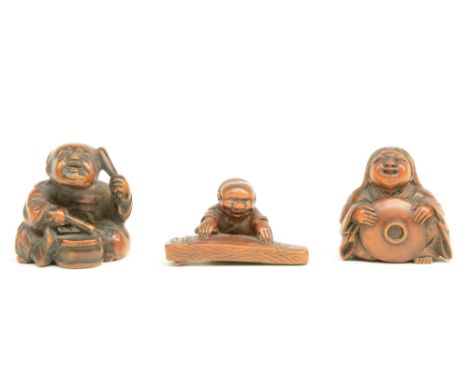 Three Japanese wooden katabori netsuke depicting a lady with hat; a jolly koto-player and an avid drummer, all of them signed