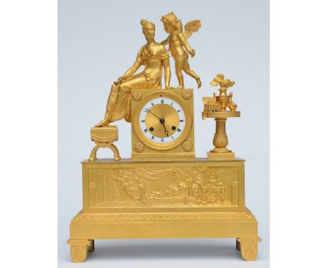 A rare ormolu mantel clock, decorated on top with Cupid and Psyche, the dial marked 'Gérard à Paris', ca. 1820, H 44 - W 33,5