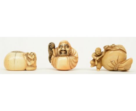 Three early Meiji period Japanese ivory katabori-netsuke, in the form of children playing with a pouch and a sunflower, a lit