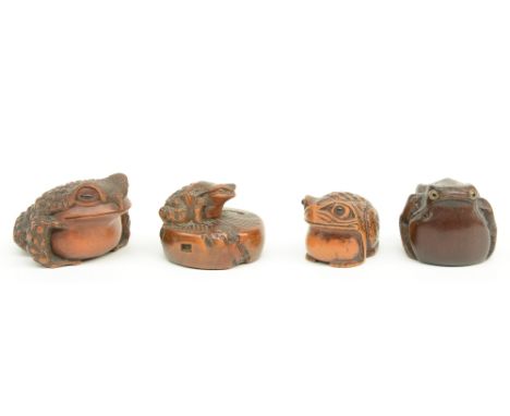 Three Japanese wooden katabori netsuke, the three of them depicting a toad, early Meiji-period; added a ditto okimono, Edo-pe