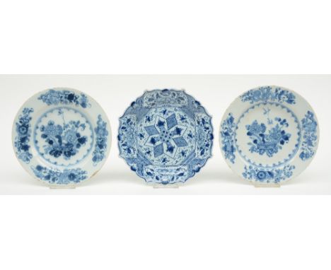 Two blue and white in the Kangxi style decorated Dutch Delftware plates, late 17thC; added a ditto 18thC plate with a lobed r