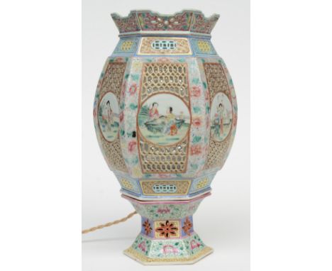 A Chinese hexagonal polychrome wedding lantern with openwork decoration on a matching base, the roundels painted with garden 