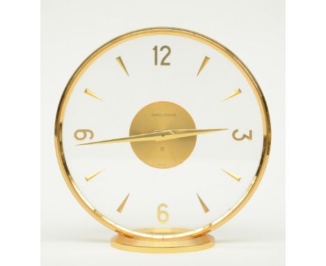 A circular gilt brass Jaeger - Lecoultre mantel clock, H 16,5 - Diameter 16,5 cm
