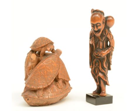 A Japanse wooden anabori netsuke depicting turtles climbing each other, signed, late Edo-period, (damage); added a ditto kata