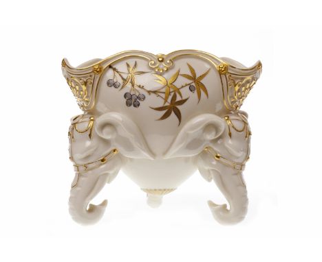 ROYAL WORCESTER TREFOIL FERN POT
decorated with gilded foliage, on three elephant head supports, pattern no. 1017, with print