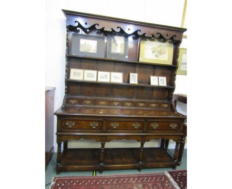 GEORGIAN DESIGN OAK DRESSER, cross banded dresser of triple frieze drawers above open shelf base, fretwork pediment, plate ra