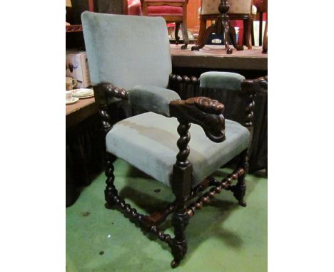 A 19th Century Jacobean style oak armchair with spiral twist and carved decoration on ceramic castors