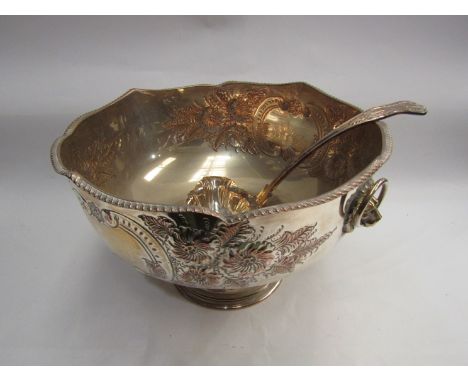 A silver plated punch bowl in the Victorian style, foliate embossed, with ladle (2)