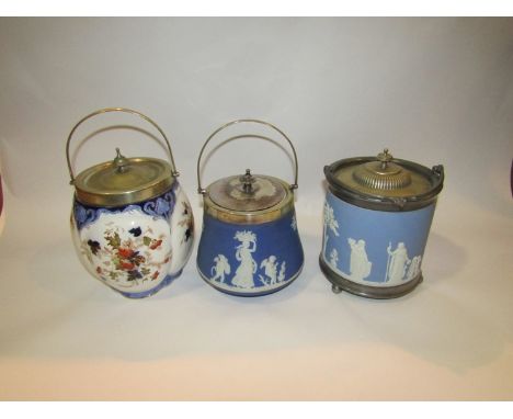 Two Wedgwood Jasperware biscuit barrels; one in light blue and white, the other in dark blue together with another example (3