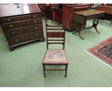 An Arts &amp; Crafts mahogany chair with original tapestry seat