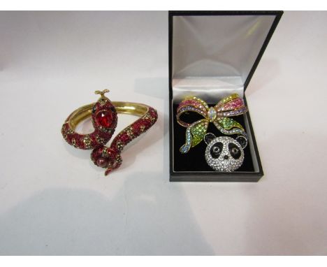 A Butler &amp; Wilson panda head brooch, rainbow bow brooch and a Butler &amp; Wilson snake bangle, boxed