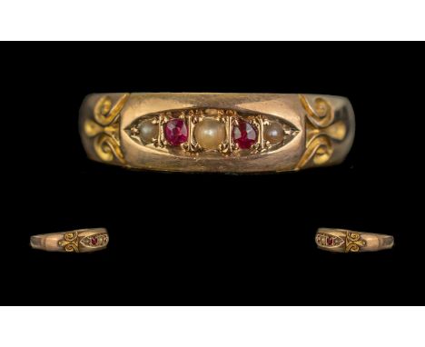 Ladies 15ct Gold - Ruby and Seed Pearl Set Dress Ring. Marked for 15ct Gold. Approx Size R. Approx Weight 2.2 grams. 