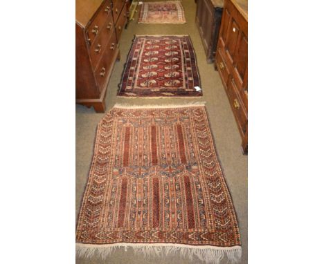 Balouch Rug, West Afghanistan, the field of columns enclosed by chevron borders, together with two other rugs (3)