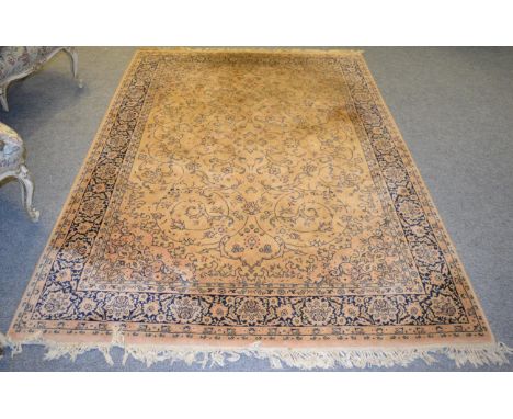 Machine made rug of Oriental design, 237cm by 166cm