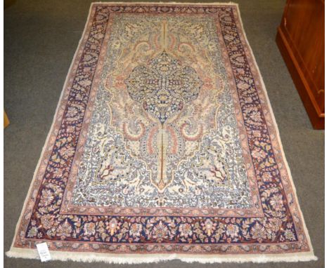 Kirshehir Rug, Central Anatolia, the tomato red field with central medallion framed by spandrels and mustard borders