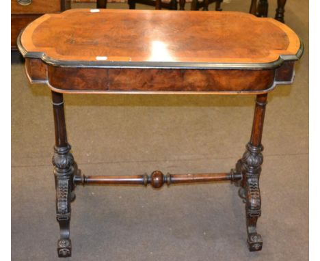 A Victorian burr walnut veneered and ebonised side table 