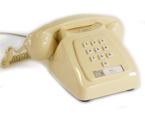 An early 1980s vintage GPO/BT ivory type 756 push button telephone, with bell on/off button.