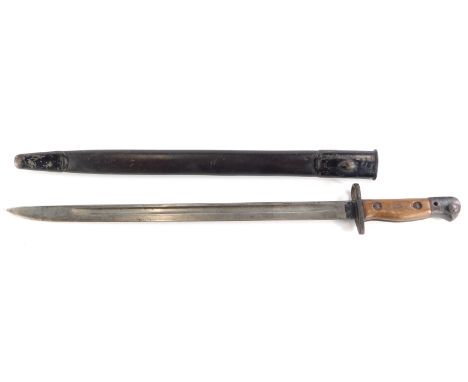 A First World War period bayonet, with mahogany handle and part leather scabbard, 58cm long. 