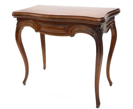 A 19thC French mahogany card table, the serpentine shaped top with a moulded edge above a scroll carved frieze on cabriole le