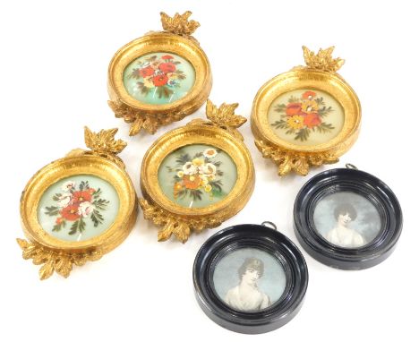A set of four miniature glass paintings, each decorated with flowers in gilt frames, and a pair of late miniature prints, eac